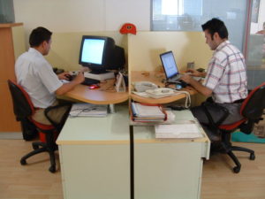two office workers on computer