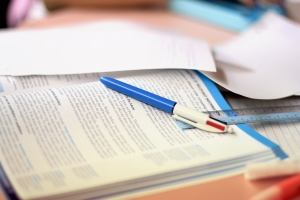 Study table with finance book and pen