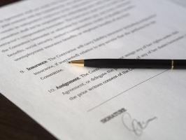 Business contract and pen